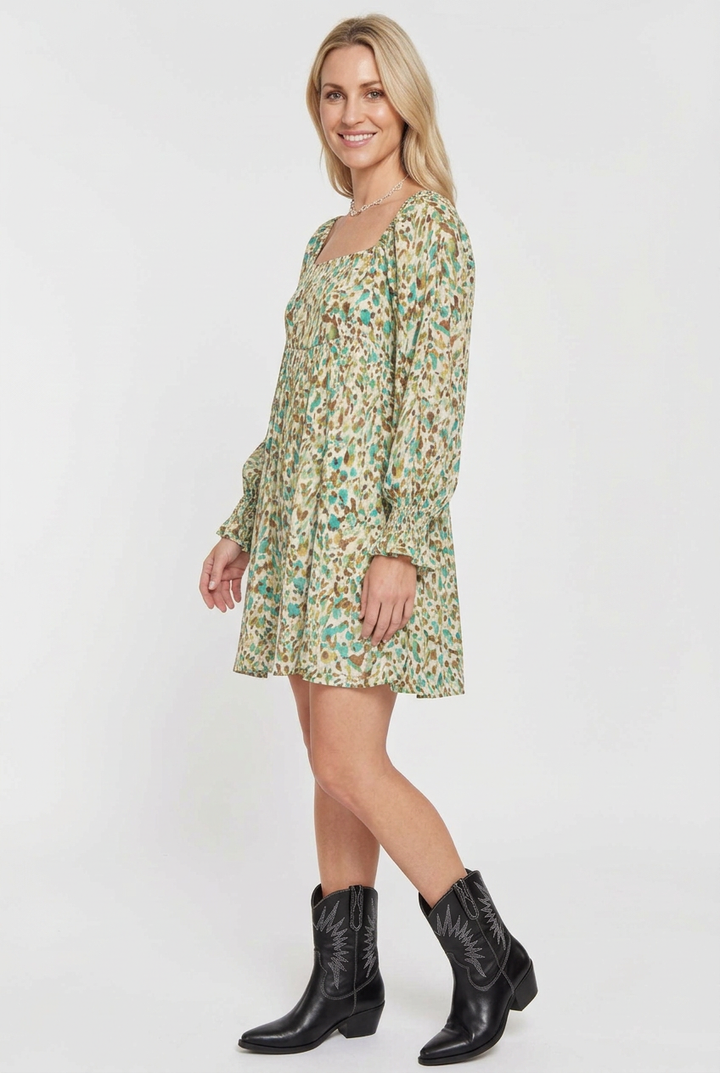Printed mini dress side studio view