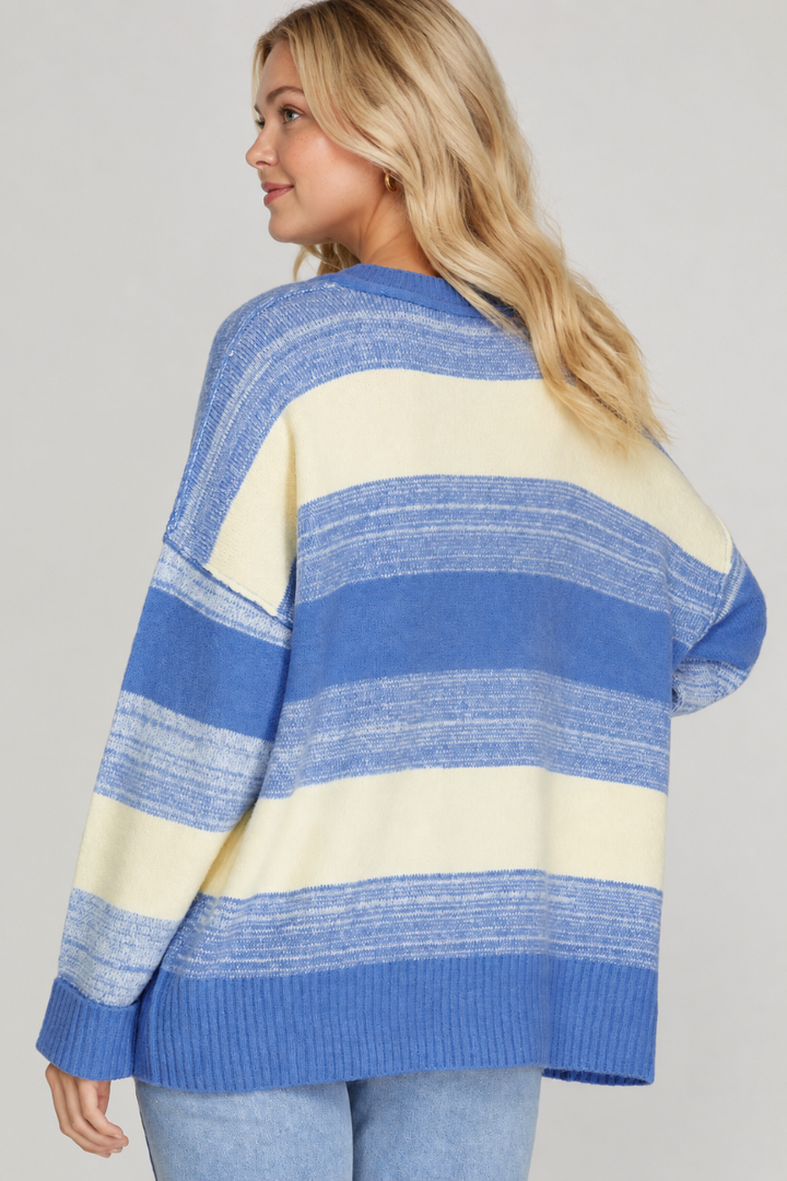 Product photo, blonde model, full back pose, studio background, blue and cream striped sweater preserved