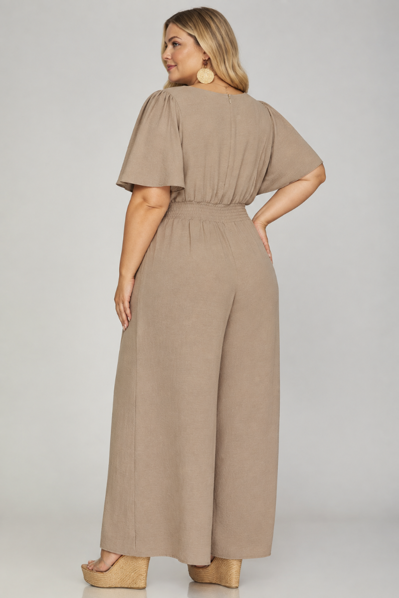 Product photo, plus size blonde model, full back pose, studio background