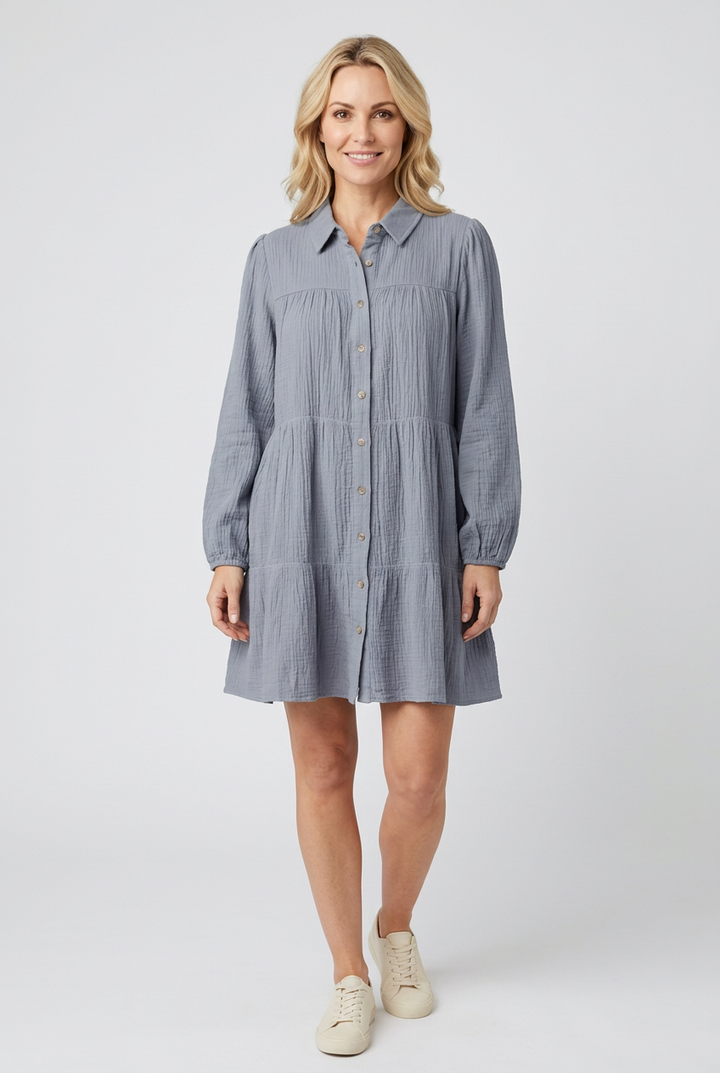 Regular-size blonde model wearing the dusty-blue tiered dress