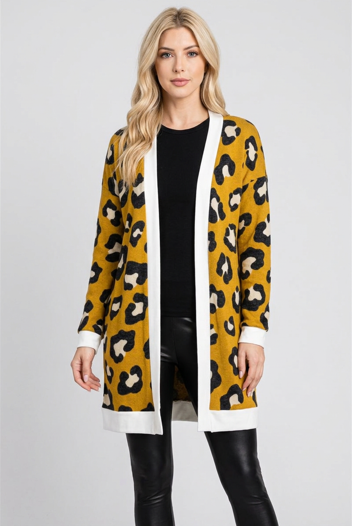 Regular-size blonde model wearing the mustard leopard cardigan without a beanie