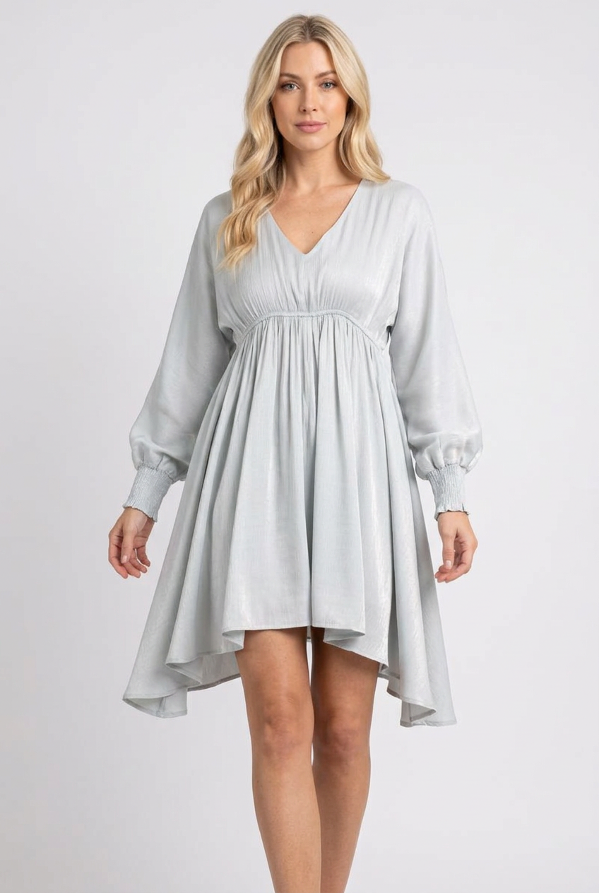 Regular-size blonde model wearing the pale blue-gray flowing dress
