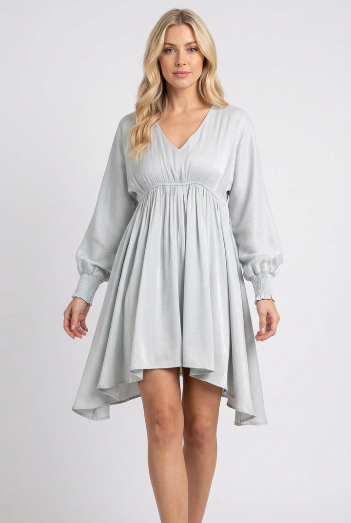Regular-size blonde model wearing the pale blue-gray flowing dress