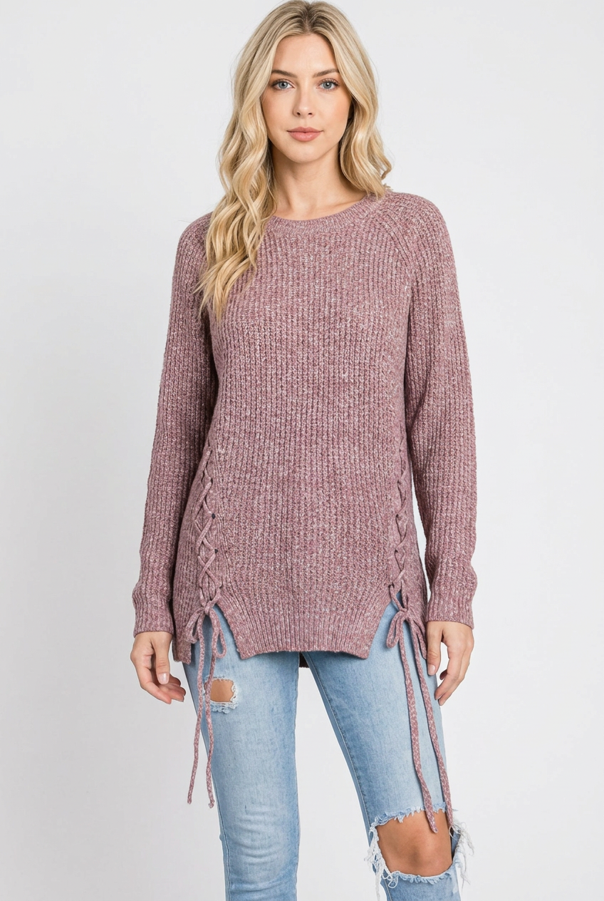 Regular-size blonde model without a beanie wearing the mauve lace-up sweater