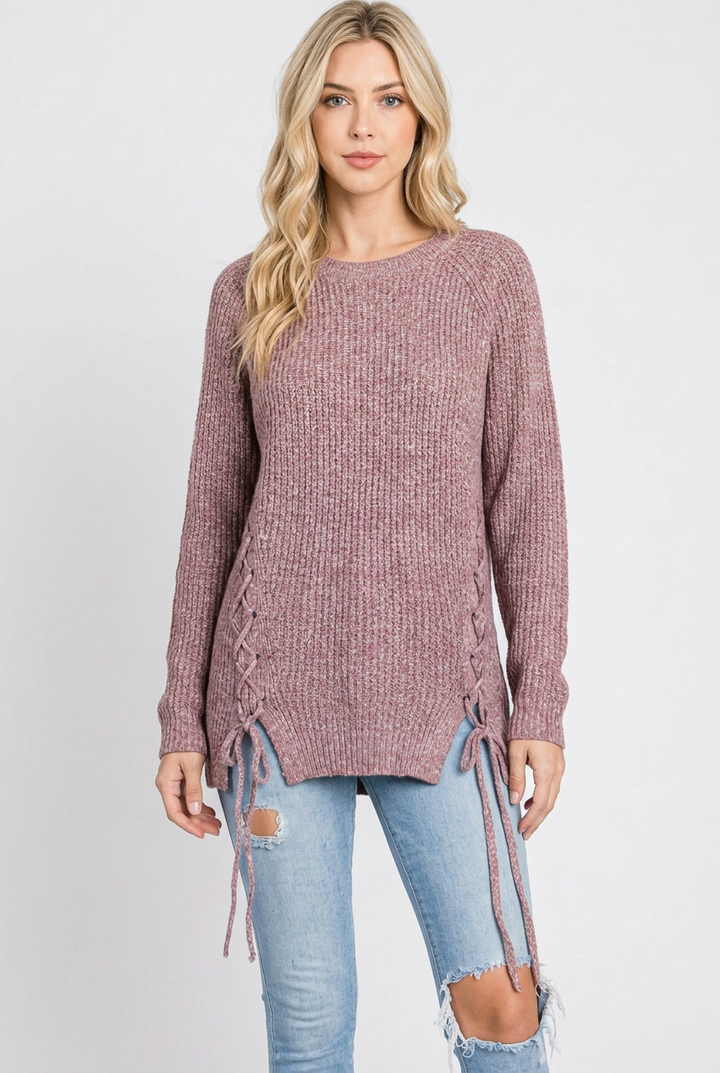 Regular-size blonde model without a beanie wearing the mauve lace-up sweater