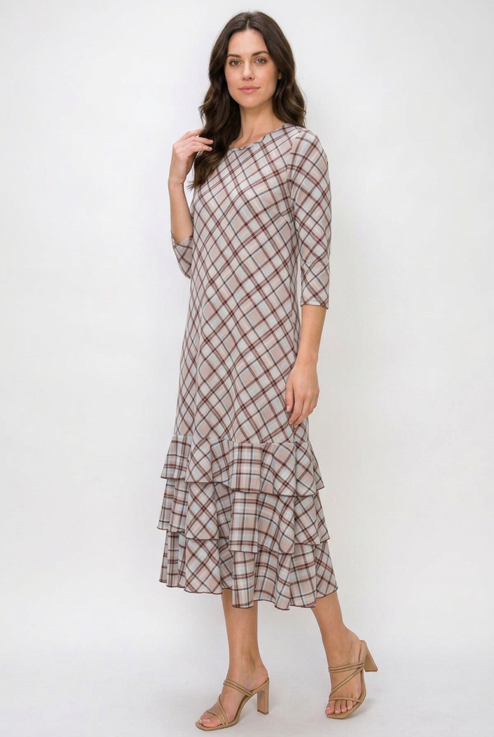 Regular-size brunette model in a side pose wearing the plaid dress