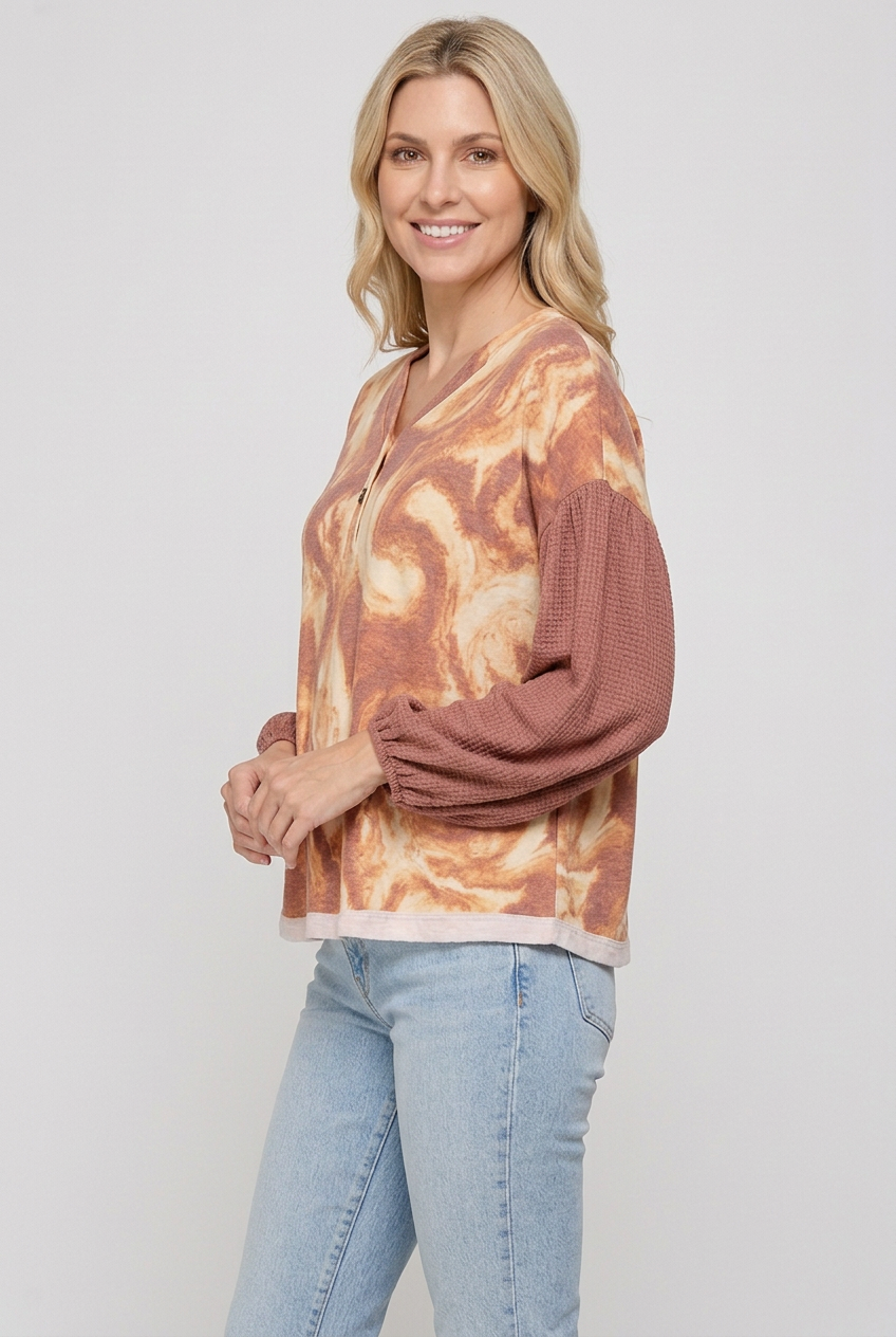 Rust-and-cream marbled top side studio view