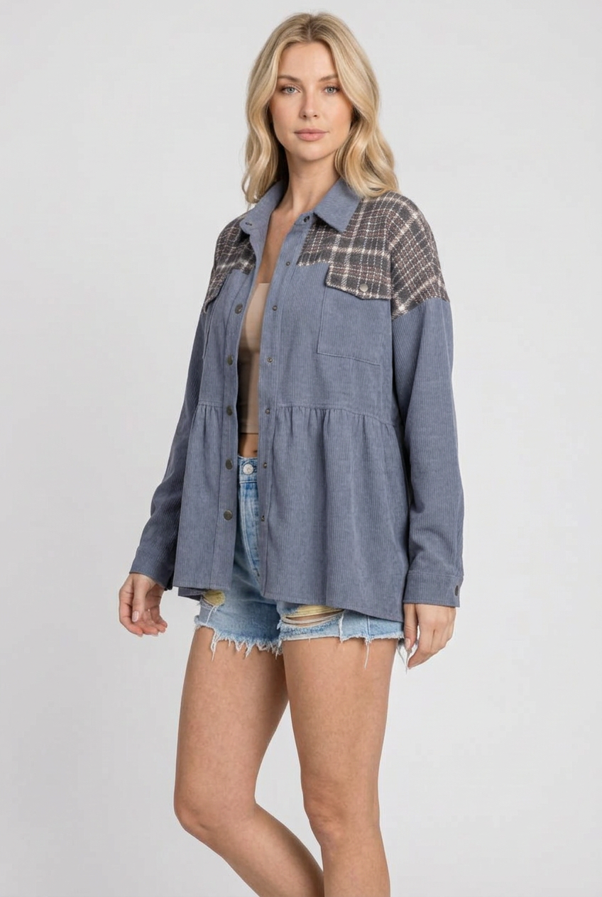 Side studio pose wearing the blue-gray plaid-yoke jacket and denim shorts