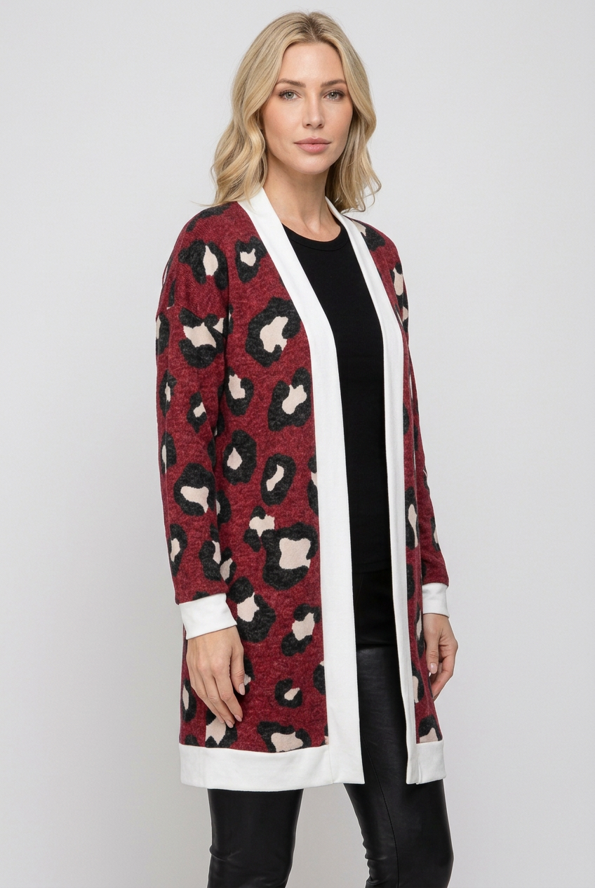 Side studio pose wearing the burgundy leopard cardigan