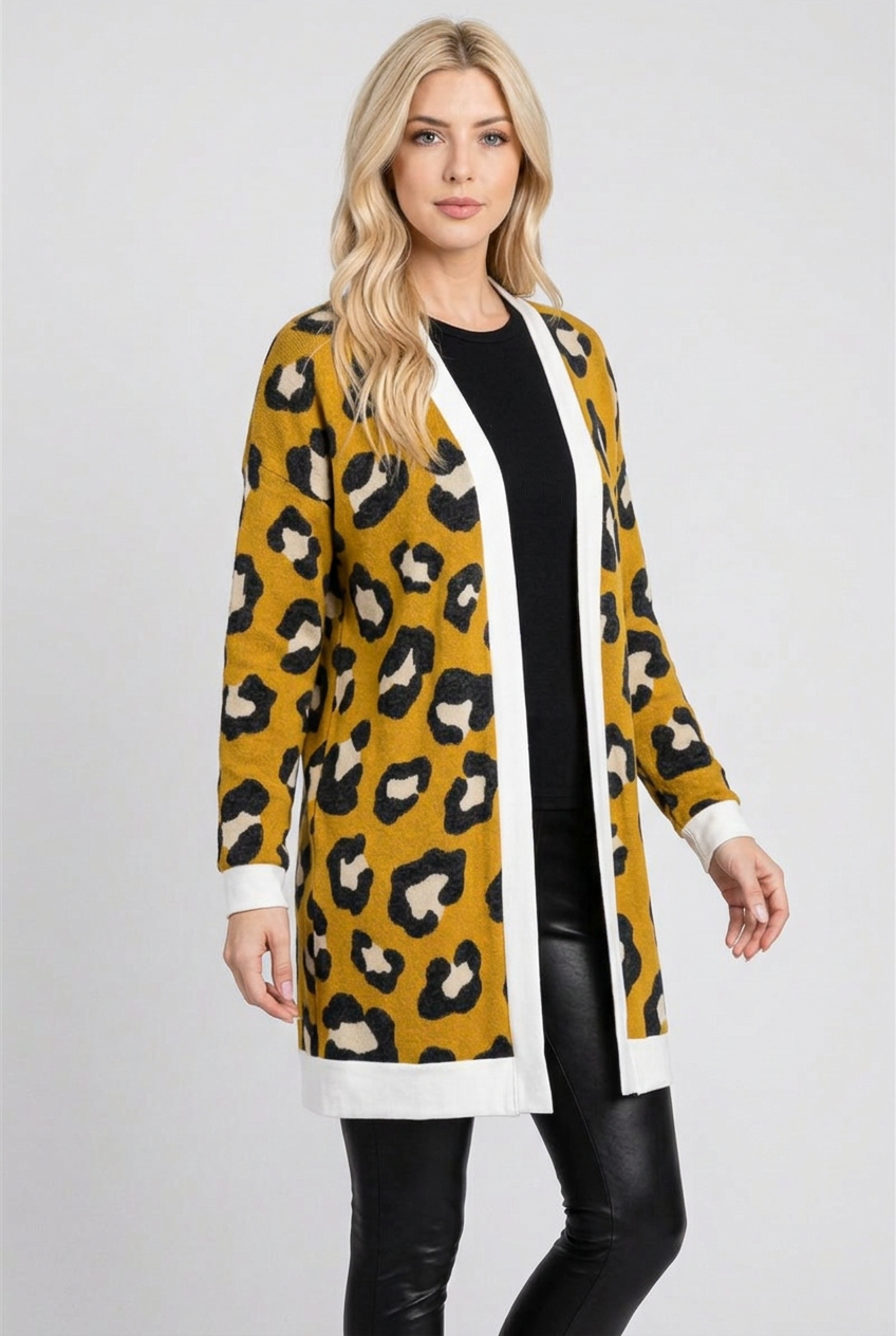 Side studio pose wearing the mustard leopard cardigan