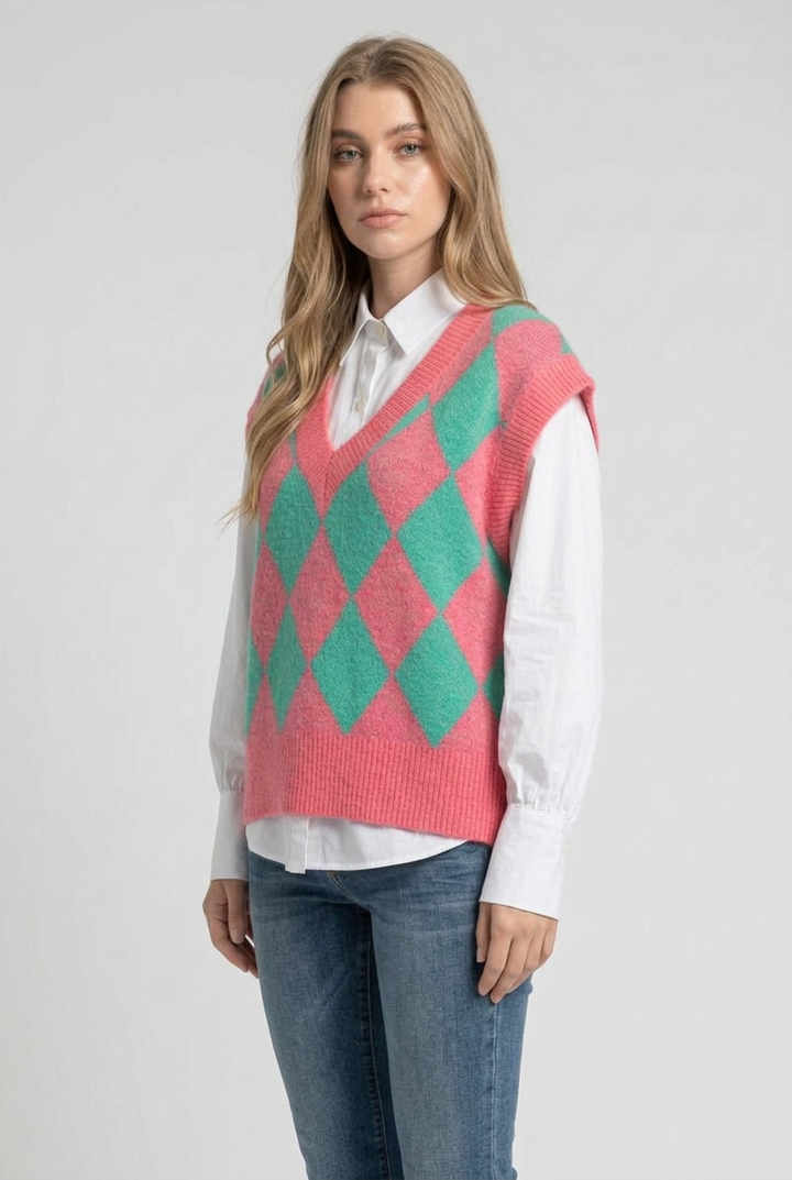 Side studio pose wearing the pink-and-green diamond vest