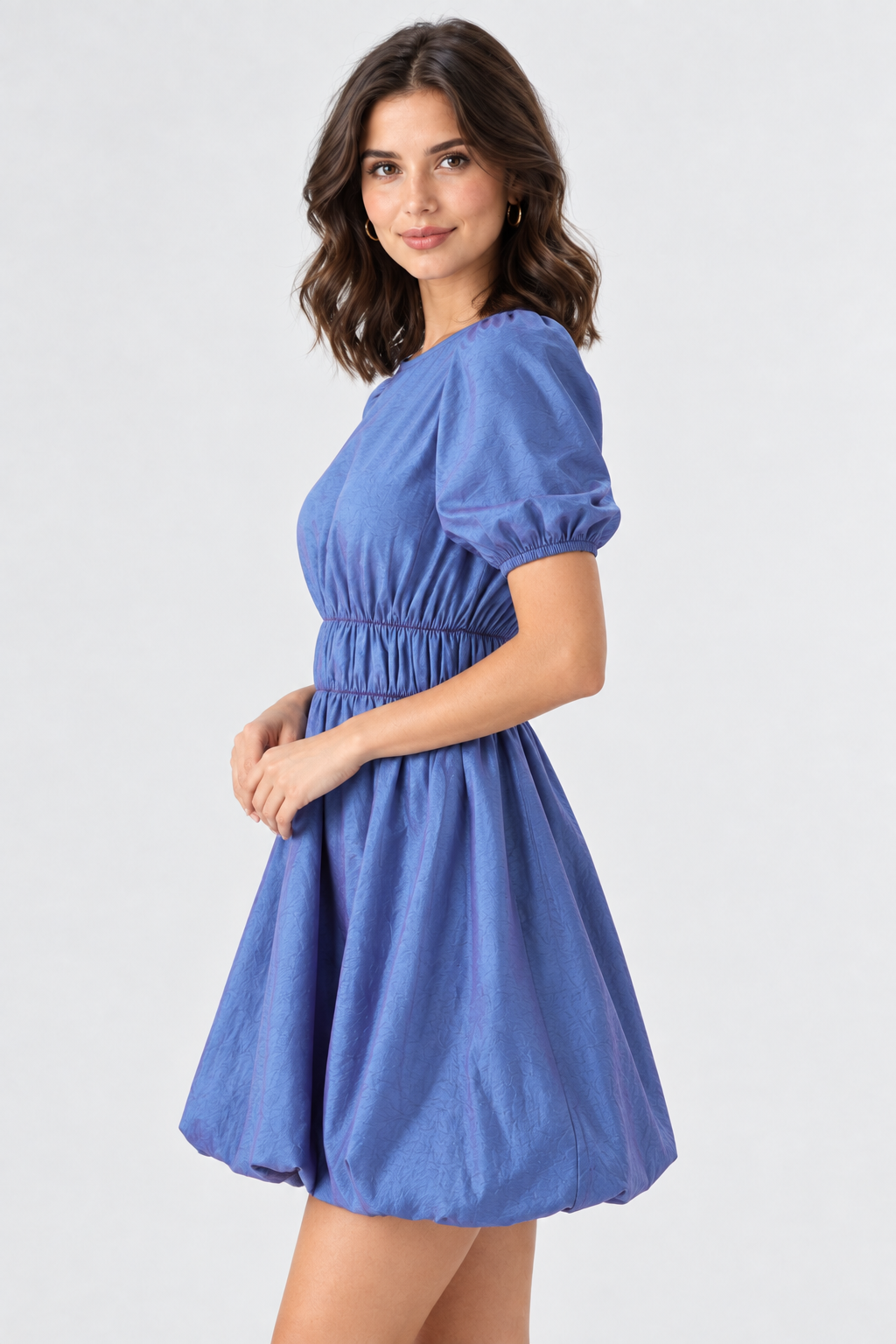 Side view, face facing forward, blue puff-sleeve dress, studio background