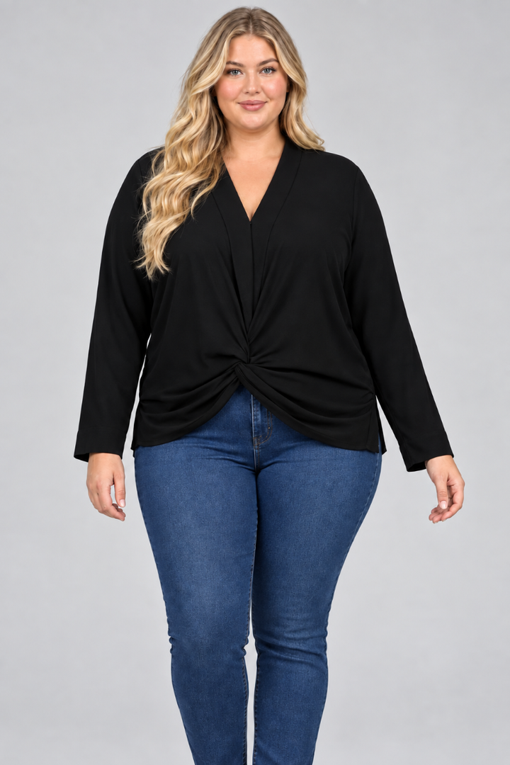 Studio front view of a plus-size blonde model in the black draped V-neck blouse and pants