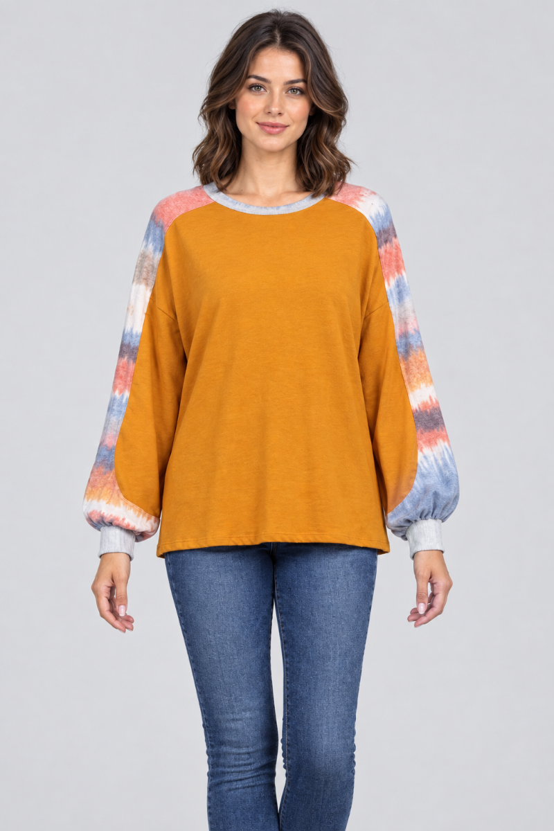 Studio front view of the mustard-orange top with tie-dye sleeves